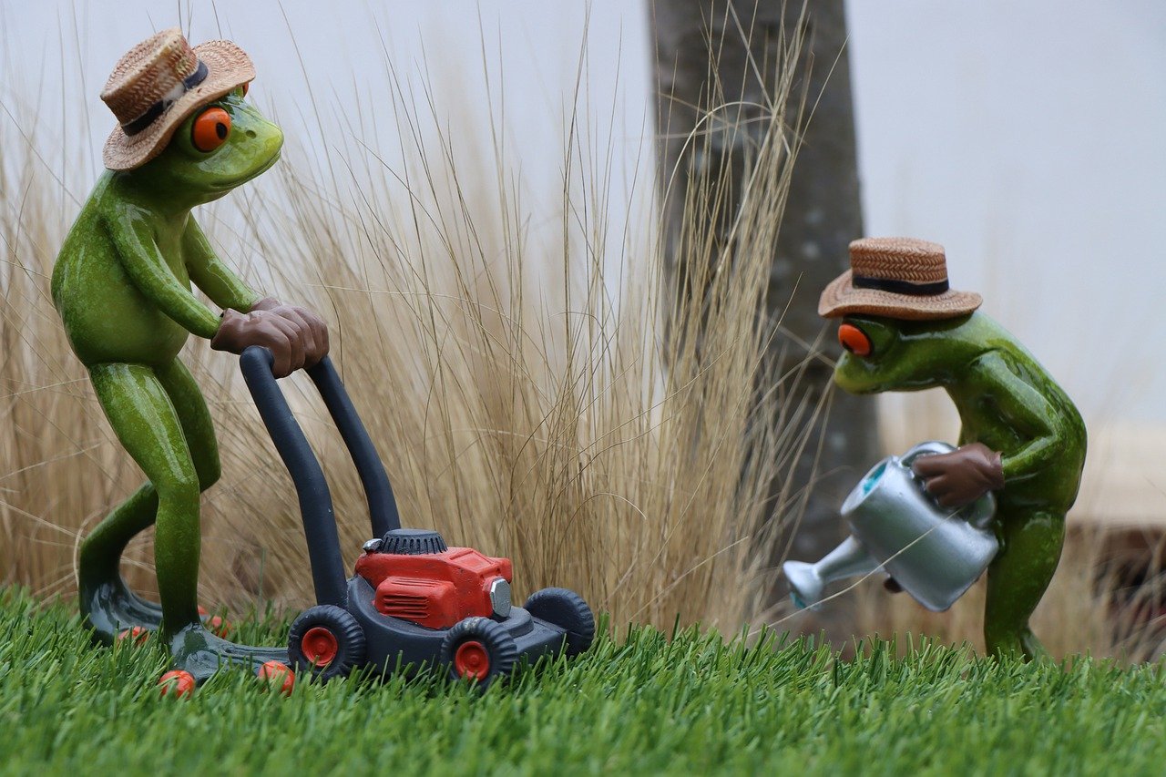 The doll is caring for and fertilizing the lawn